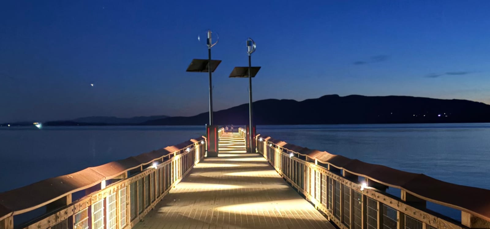 Solar lighting along the deck of Bellingham Pier at dusk